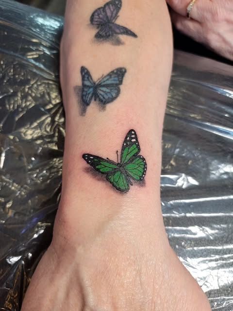Butterfly tattoos on arm